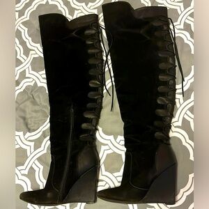 Knee high suede wedge boots.